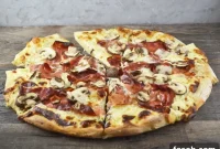 Speck and Mushroom Pizza with Melted Cheese