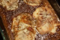French Onion Pork Chops with Caramelized Onions and Melted Cheese