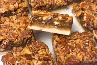 Chewy Pecan Pie Bars with Gooey Caramel Filling