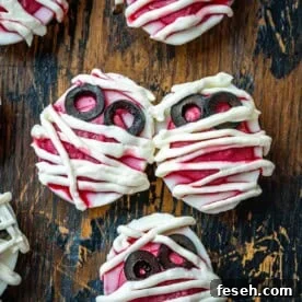 deviled eggs on a cutting board, looking like mummies.