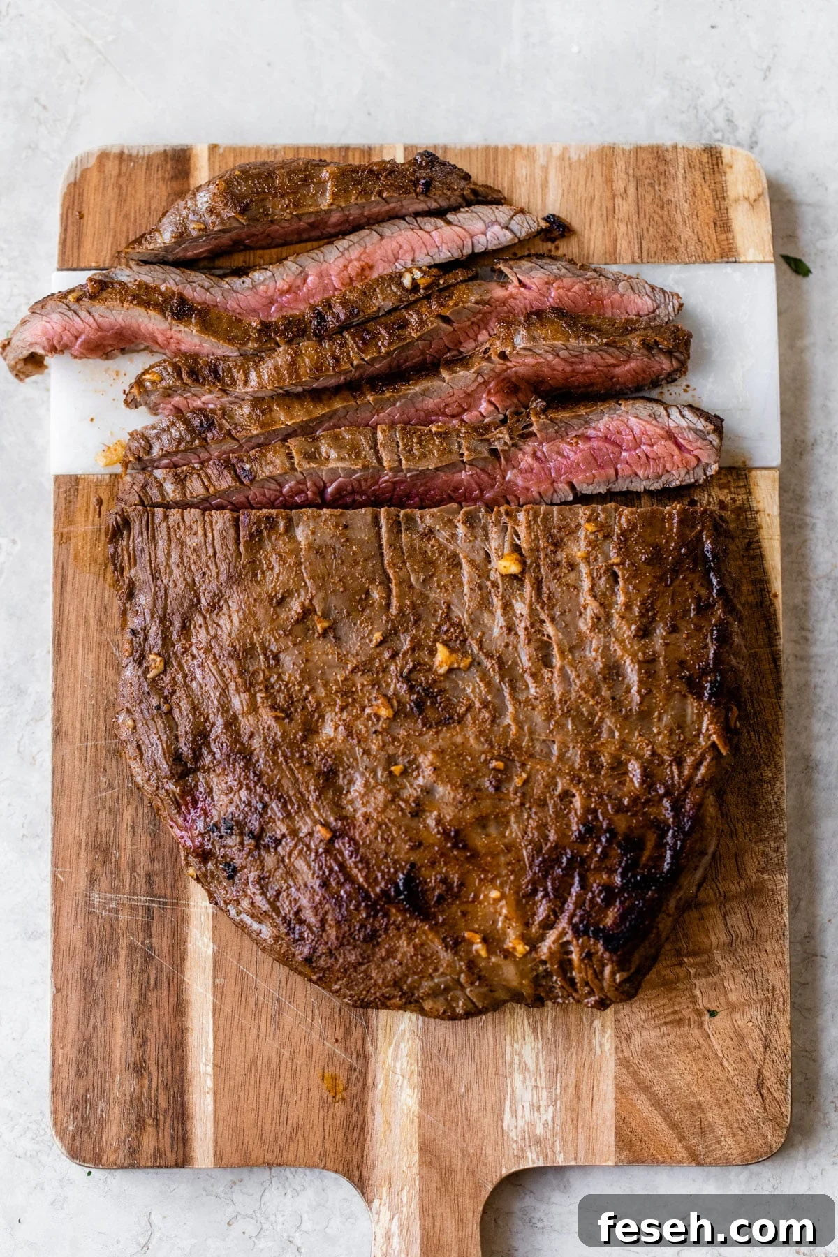 sliced steak on a cutting board