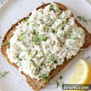 Cottage cheese chicken salad on toast garnished with dill.