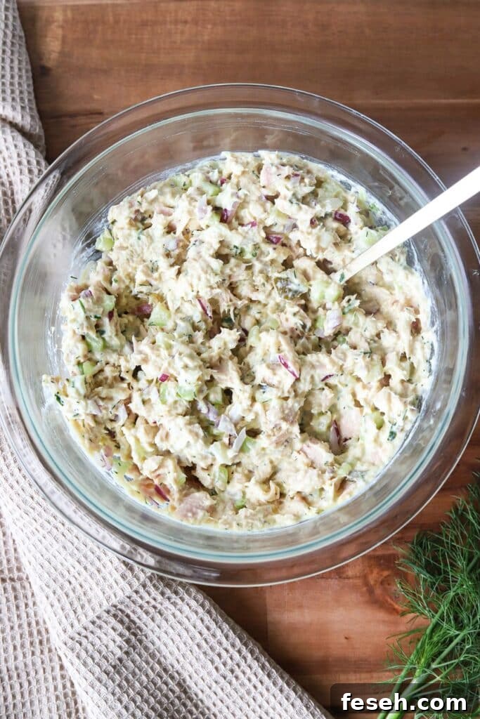Cottage cheese tuna salad mixed in a glass bowl.