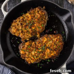 Two Blue Cheese Crusted Steaks in a skillet