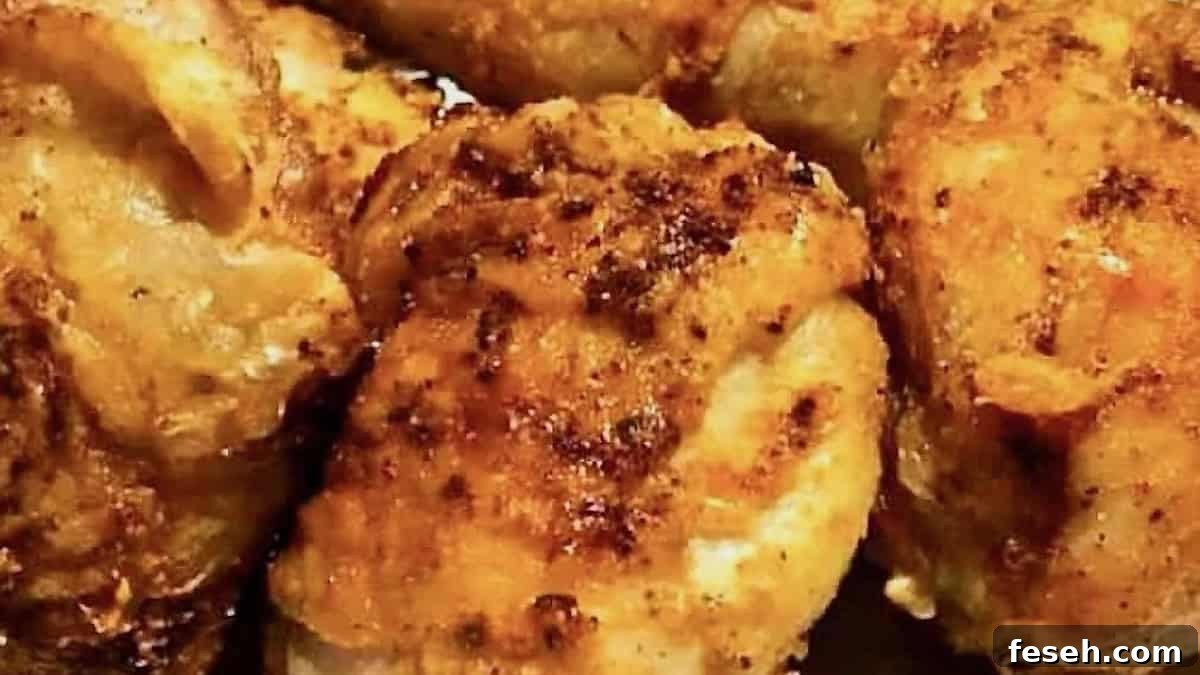 Close-up of crispy and juicy fried chicken made in the air fryer. The chicken is golden brown with a flavorful seasoned crust, ideal for a quick and delicious dinner.