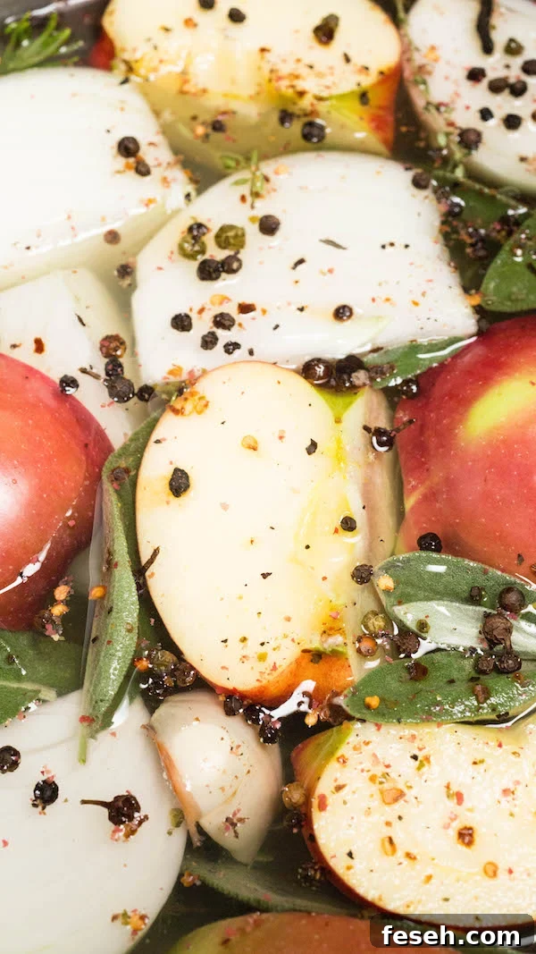 Apple sliced and peppercorn with fresh sage floating in red wine turkey brine.
