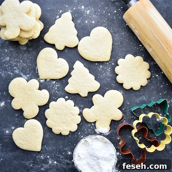 different shaped sugar cookies on a black background
