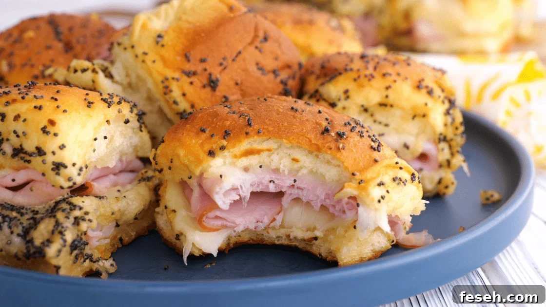 Bite taken out of ham and swiss slider.