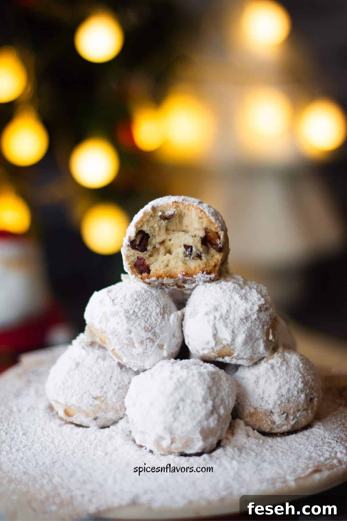cookie sliced in half placed on a pyramid of other cookies showing the texture from within