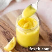 Square hero of vegan lemon curd in a mason jar.