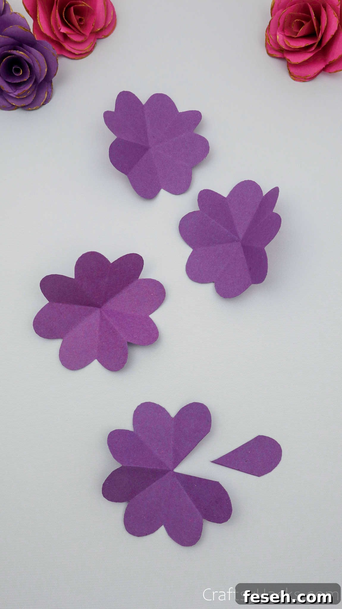 4 purple paper flowers