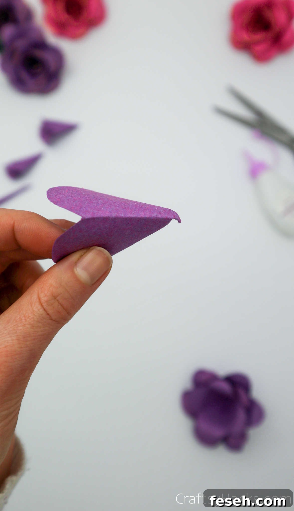 holding paper petal