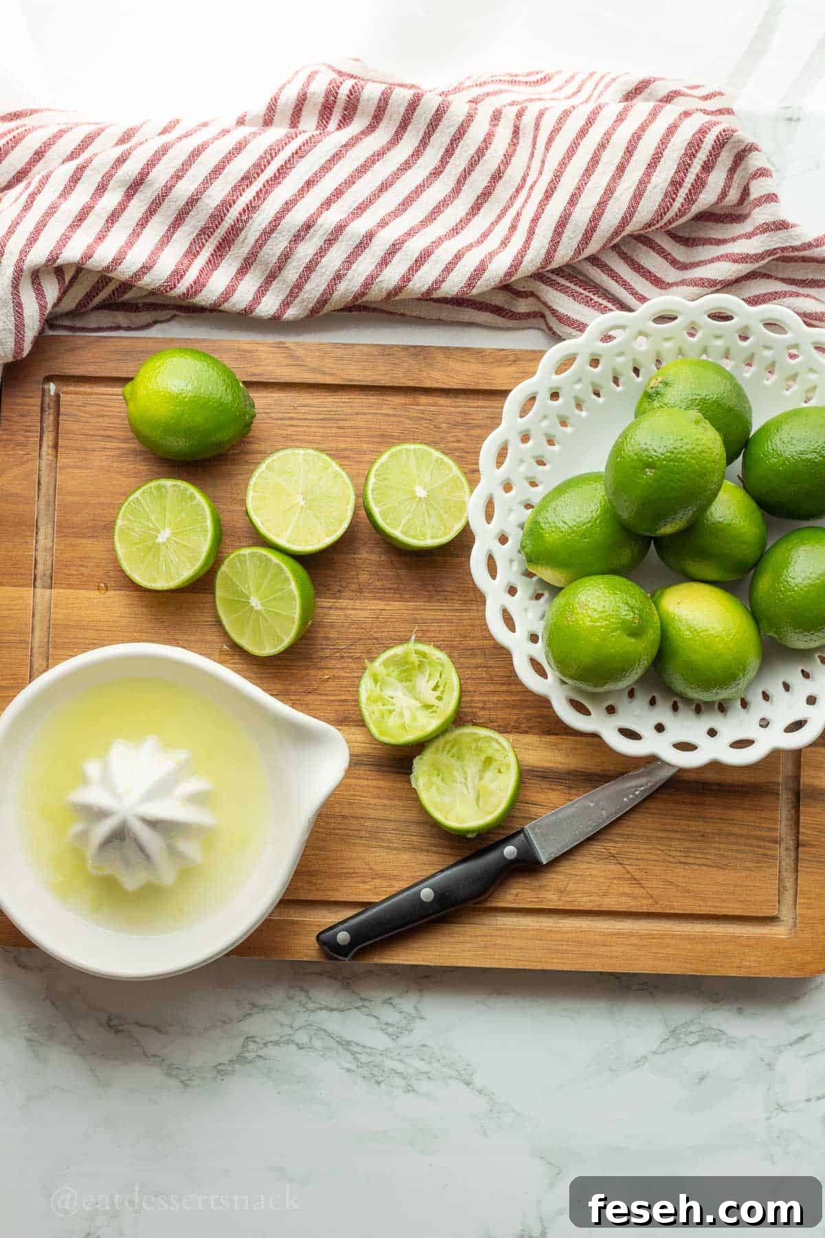 Squeezing limes into dish.
