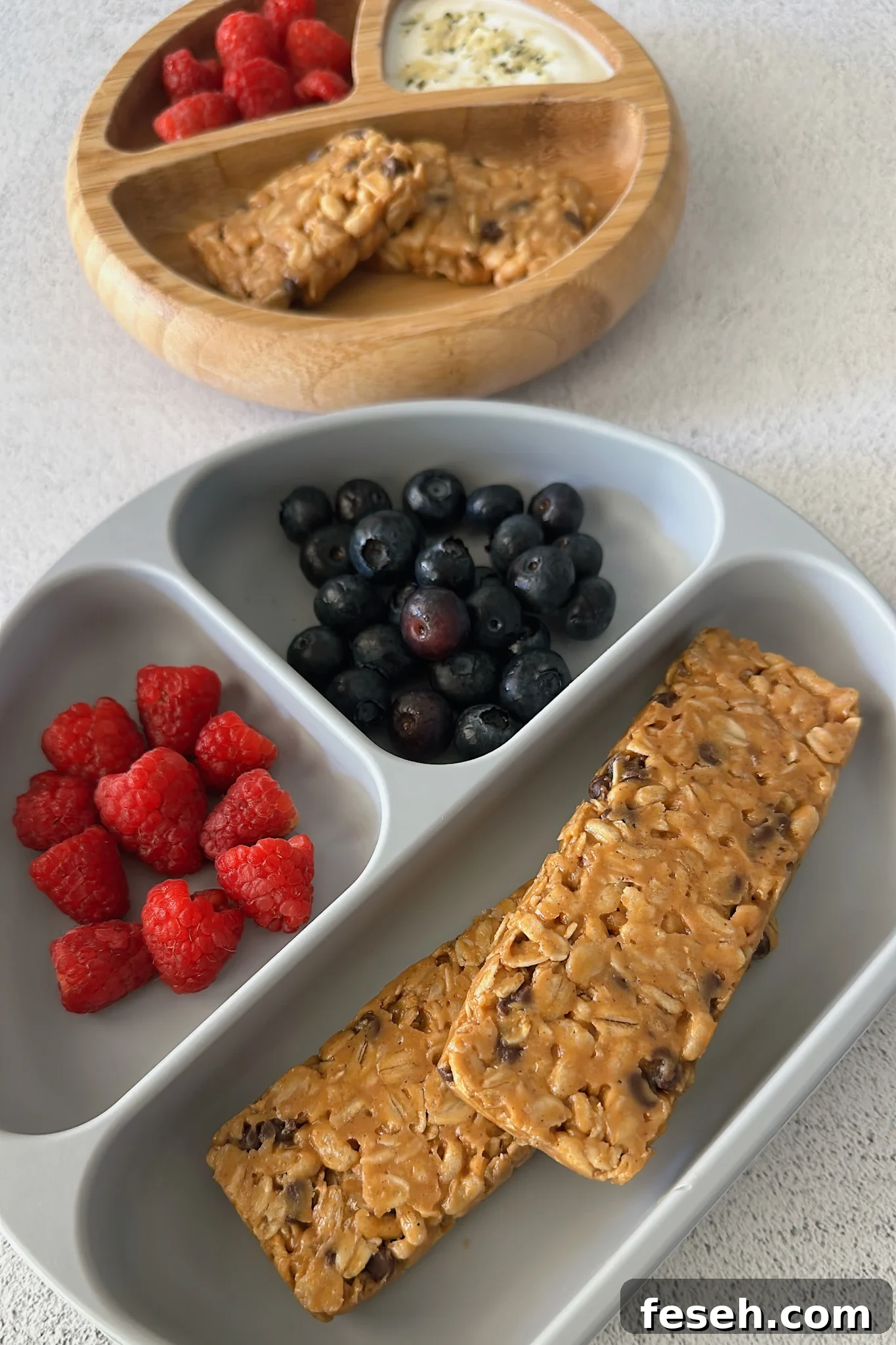 Chocolate chip chewy granola bars served with berries.