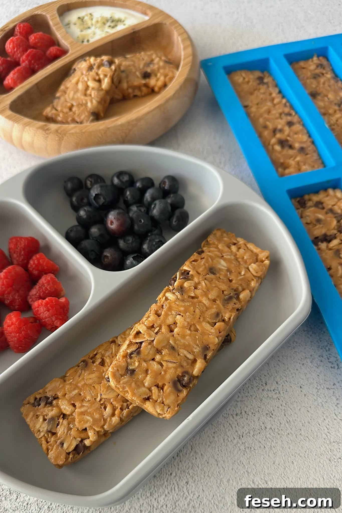 Chocolate chip chewy granola bars served with berries.