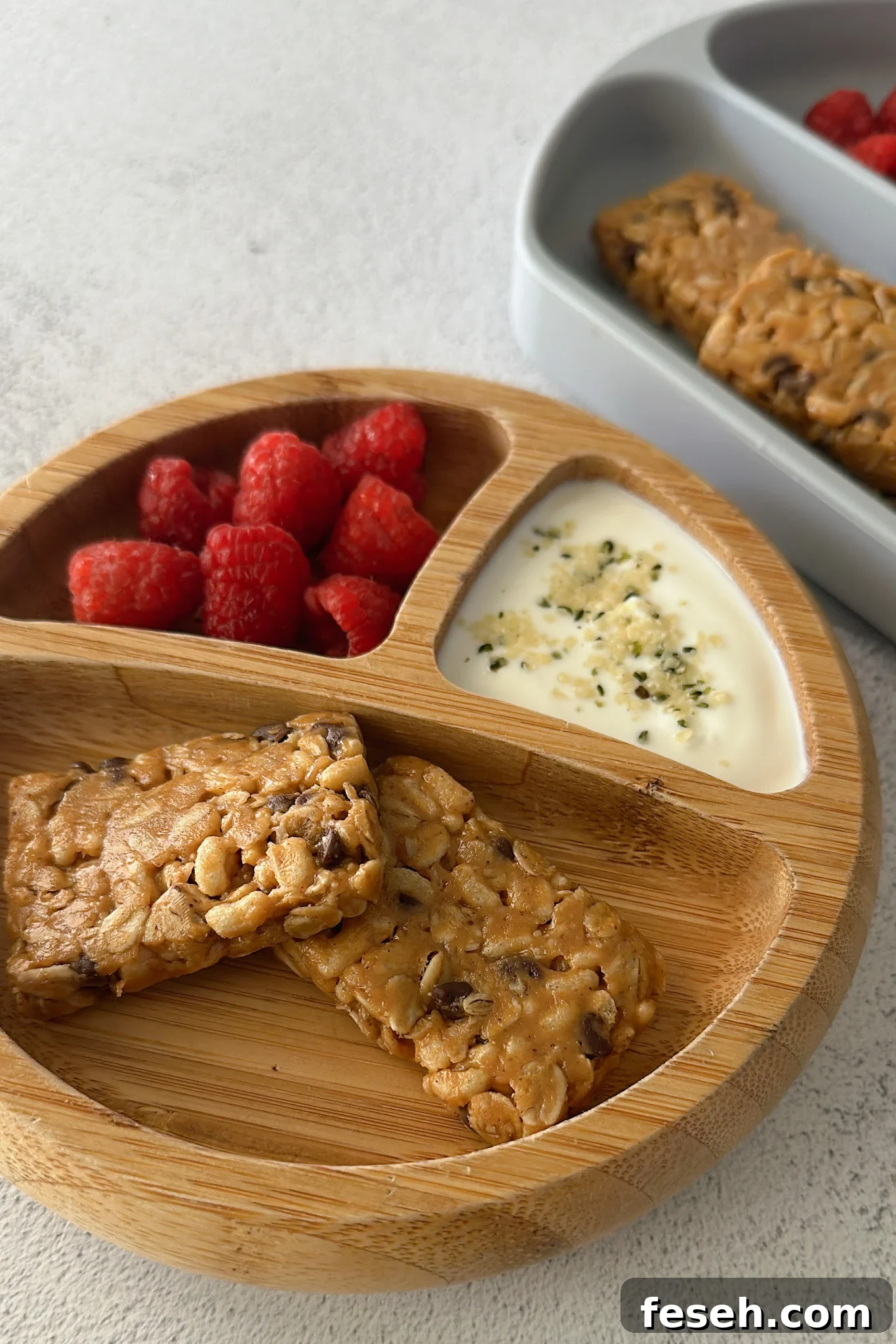 Chocolate chip chewy granola bars served with berries.