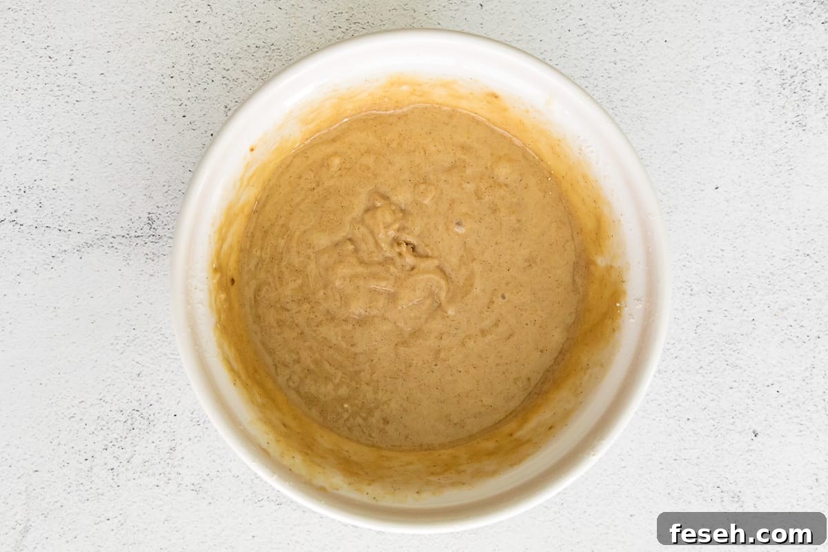 pecan pie cupcake batter after mixing in a white bowl