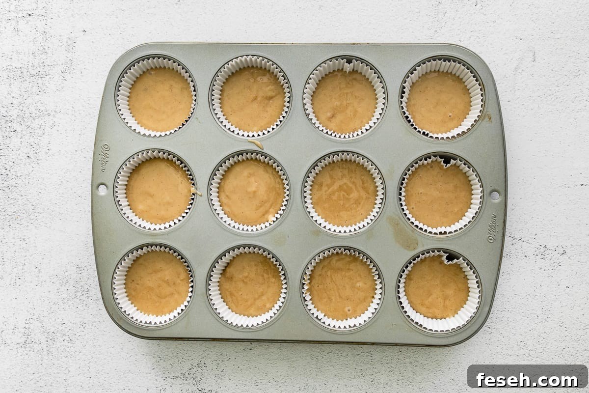 pecan pie cupcake batter in a cupcake pan before baking