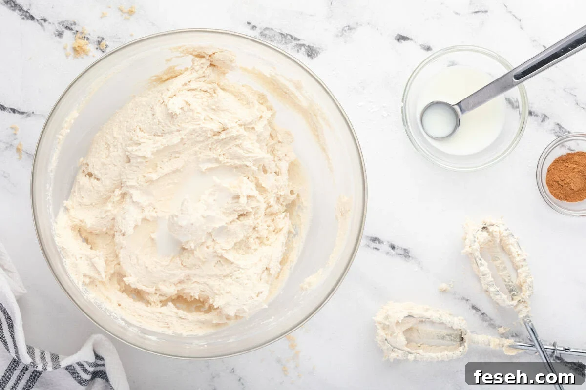 cinnamon buttercream frosting in a glass bowl.