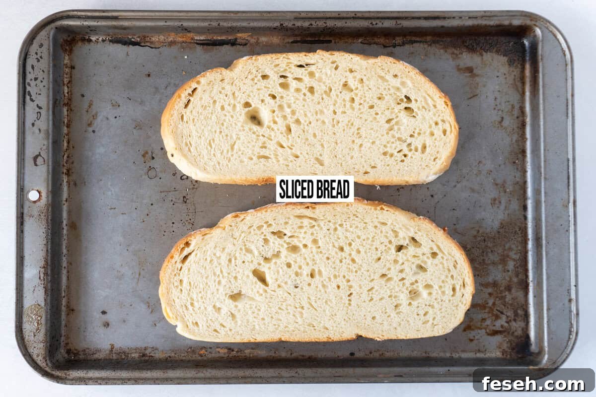 sliced sourdough on baking sheet.