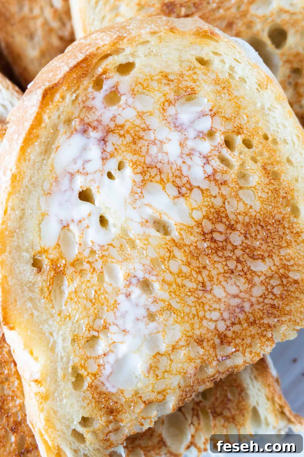 toasted sourdough with butter on melted on it.