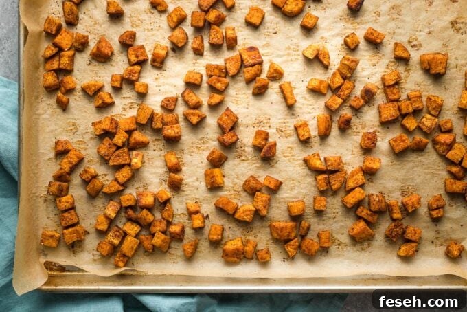 Sheet pan with roasted sweet potatoes.