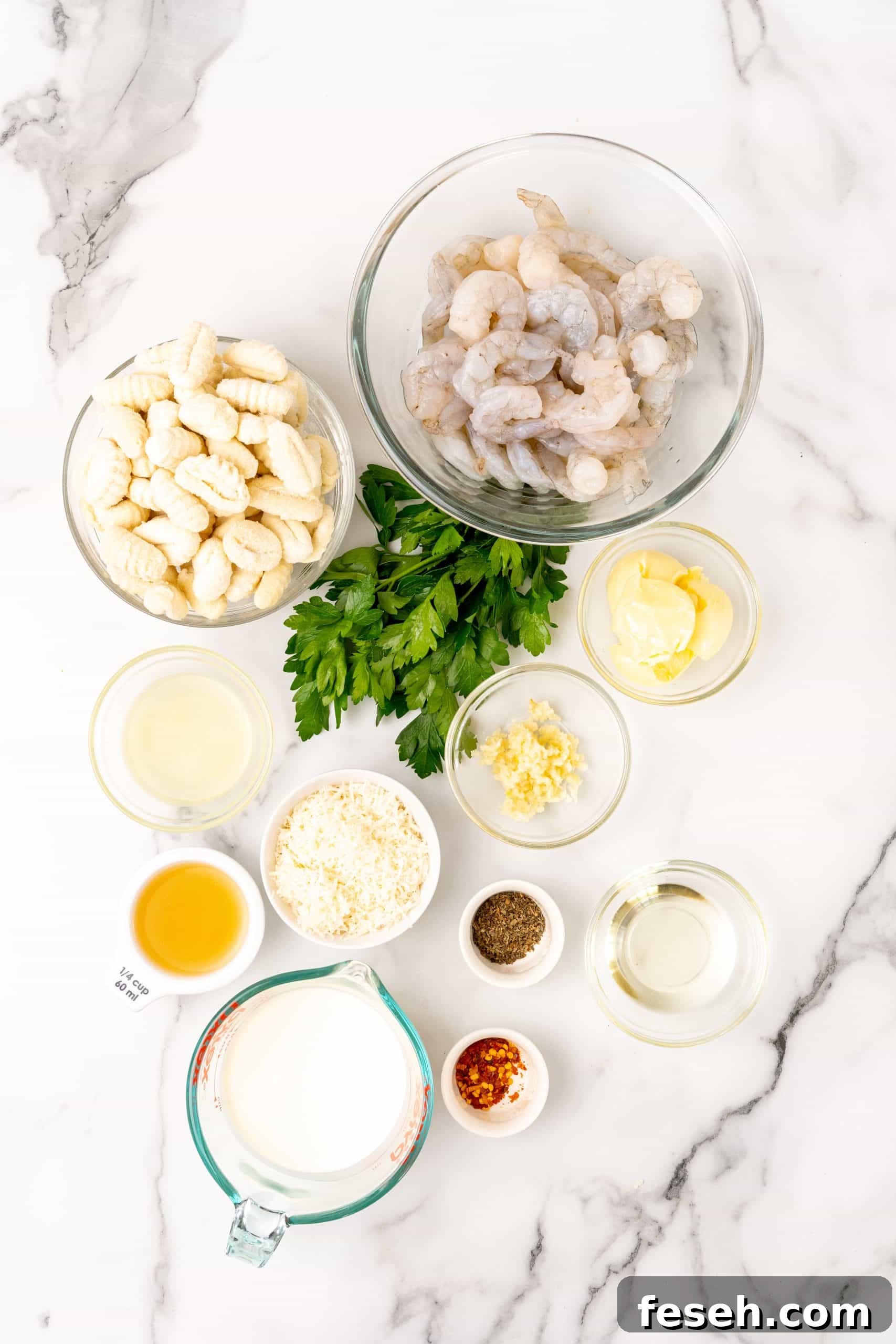 an overhead image showing the measured ingredients needed to make gnocchi shrimp scampi