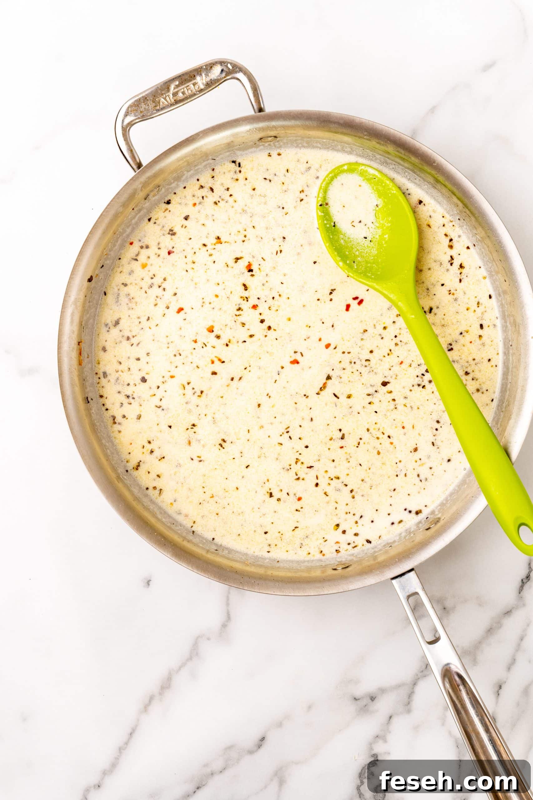 creamy scampi sauce in a large silver skillet