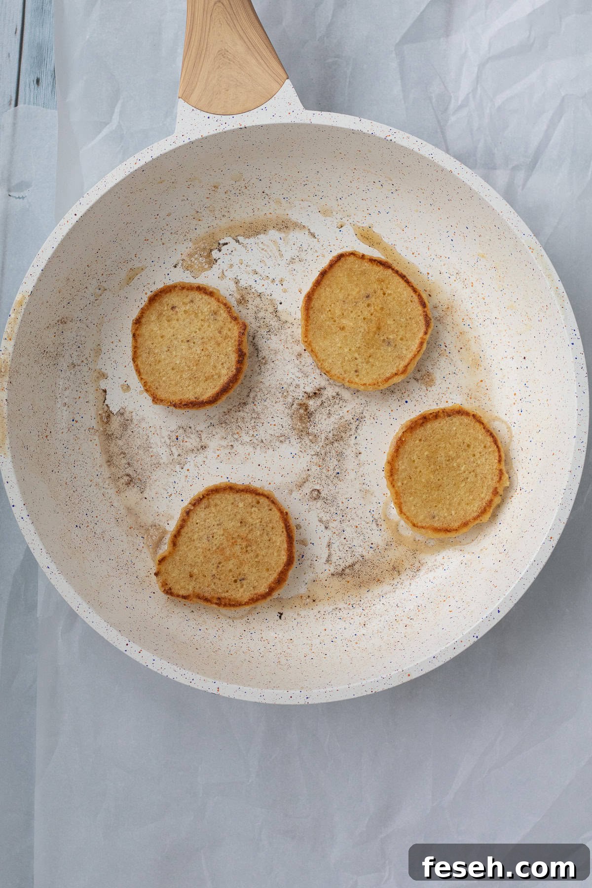 cooking matzo meal pancakes in a nonstick frying pan
