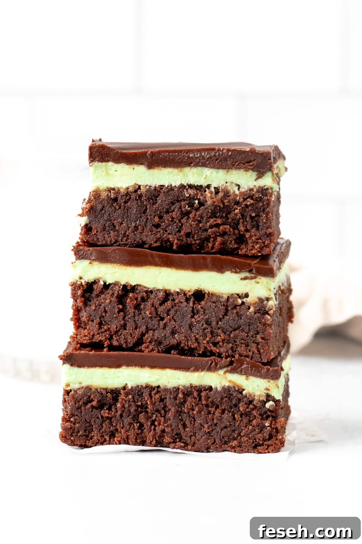 Stack of three mint brownies, one on top of another