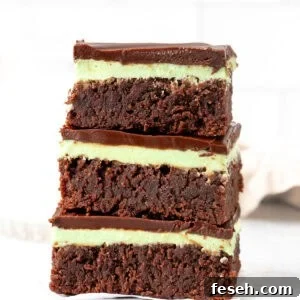 Three mint brownies, stacked one on top of each other