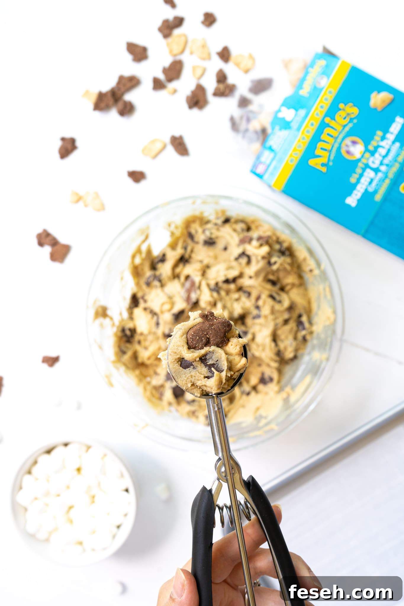 A cookie scooper with s'mores cookie dough with Annie's Bunny Grahams.