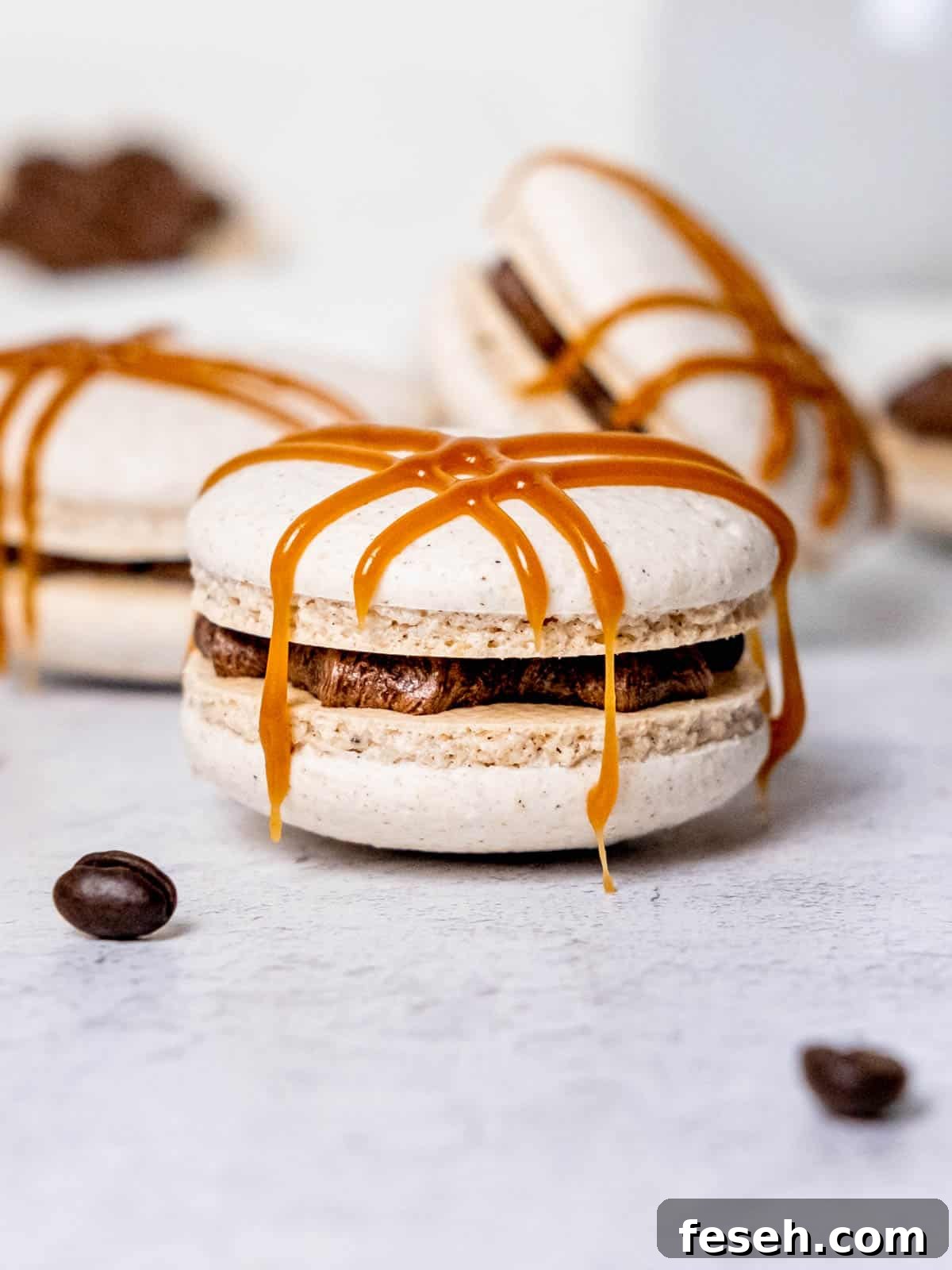 a dirty chai macaron with caramel drizzled on top