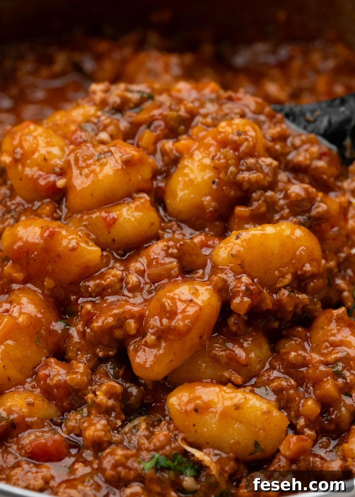Soft pillowy gnocchi nestling in thick meaty Bolognese sauce.