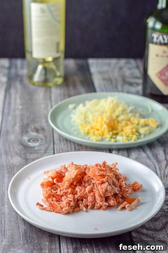 Lobster meat cut up, shredded cheese, sherry and wine in the background