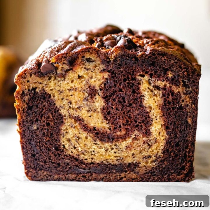 Slice of marbled chocolate banana bread.