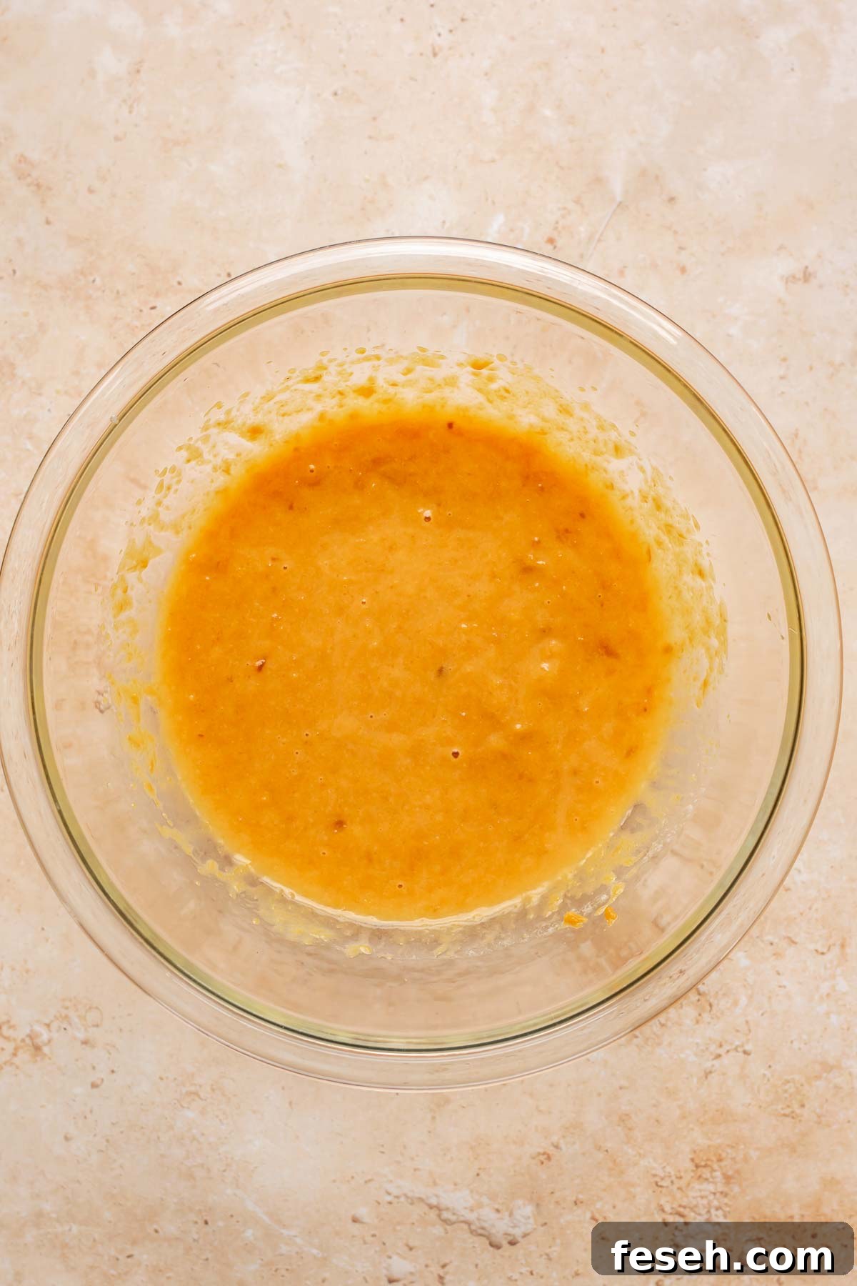 Sweet potatoes and eggs mixed in a bowl.