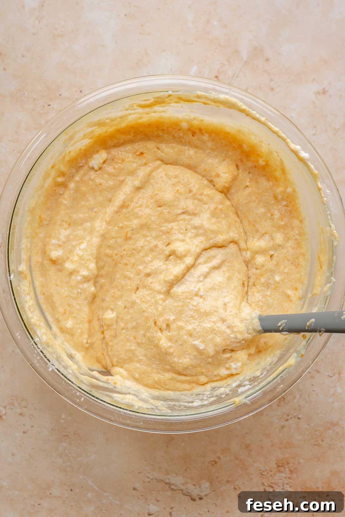 Finished waffle batter in a bowl.