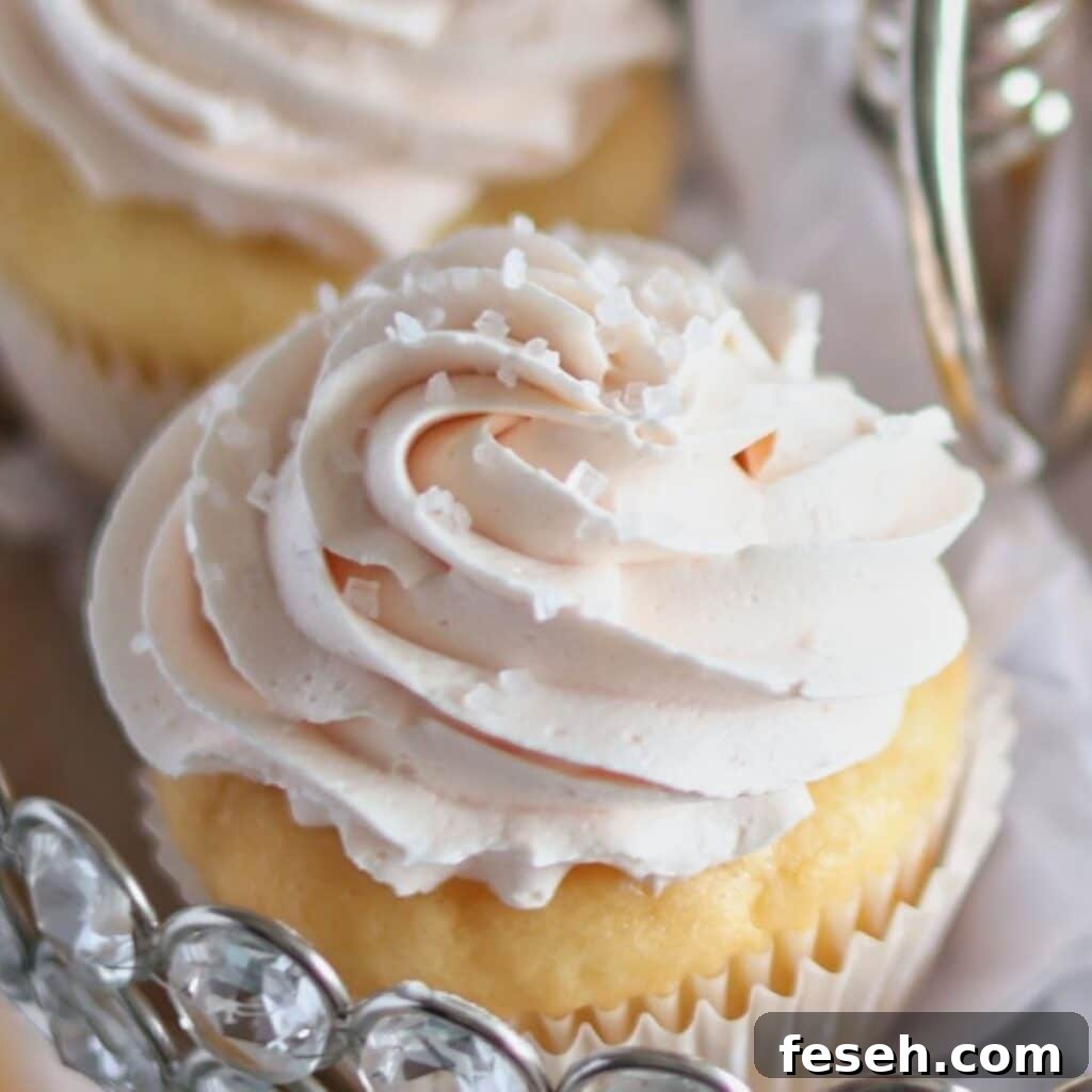 up close frosted cupcake with sparkling sugar.