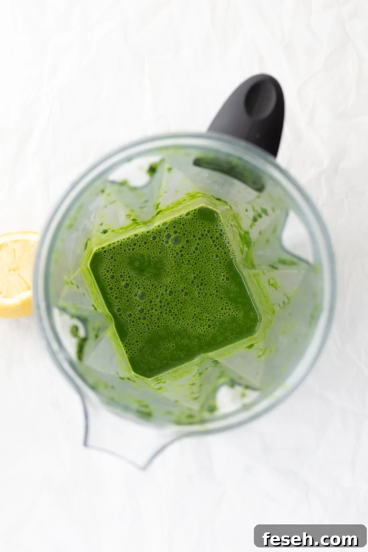 10-Minute Spinach Purée for Babies: Smooth, Nutritious Baby Food 7 thin spinach puree in a blender container