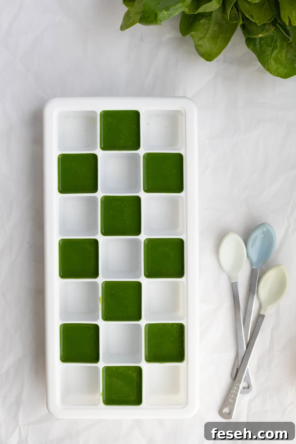 10-Minute Spinach Purée for Babies: Smooth, Nutritious Baby Food 8 spinach puree in a silicone ice cube tray