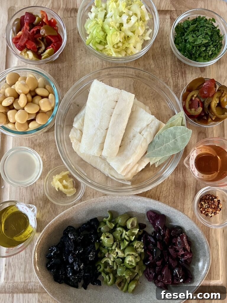 All prepped recipe ingredients in bowls on cutting board.