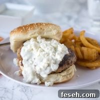 Greek Turkey Burgers - Greek flavored turkey burgers topped with tzatziki and feta