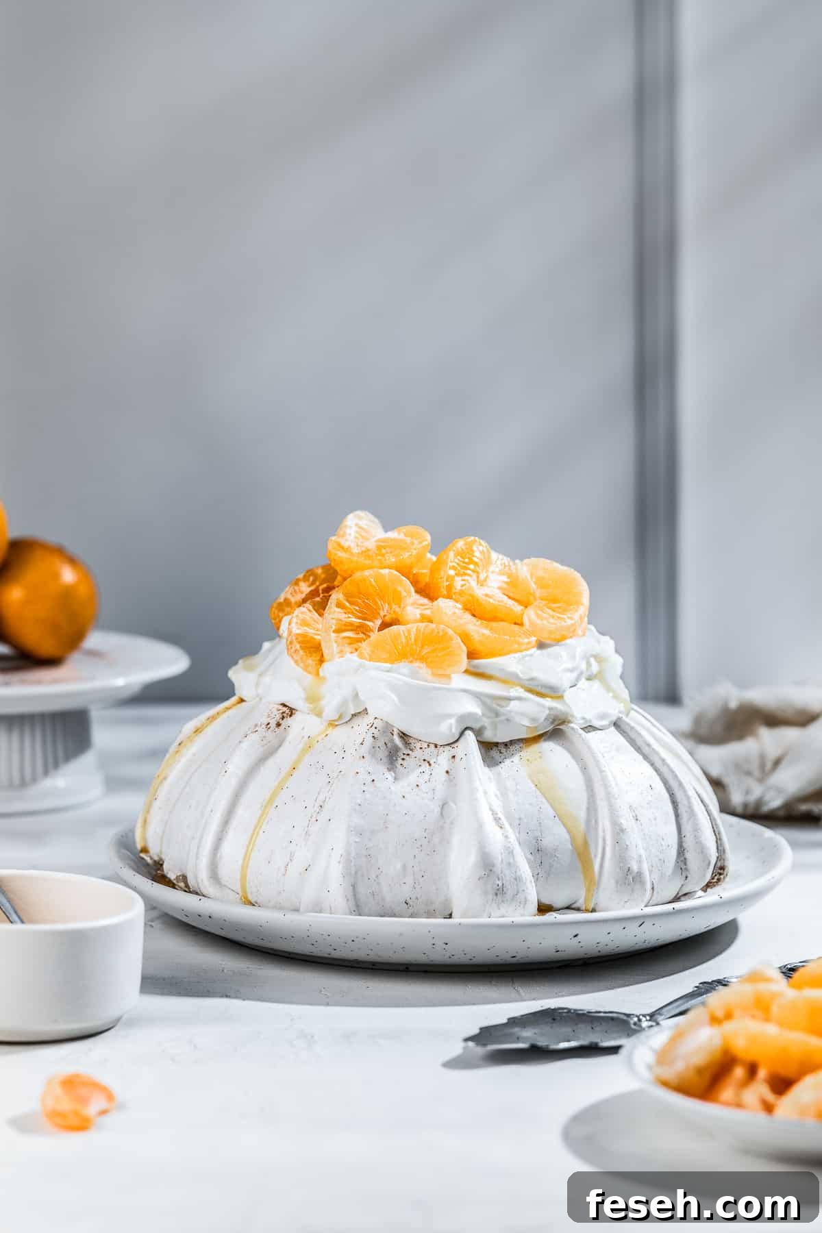 Gingerbread Pavlova with mandarin on a serving platter.