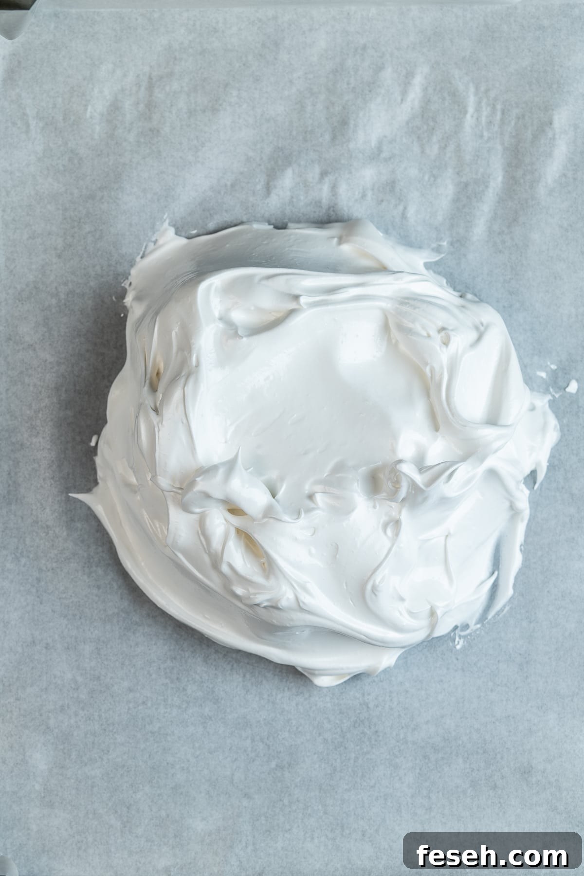 Meringue on parchment paper.