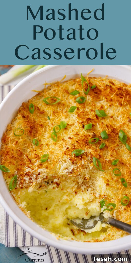 Looking down into a dish of Mashed Potato Casserole with a serving taken out of it.