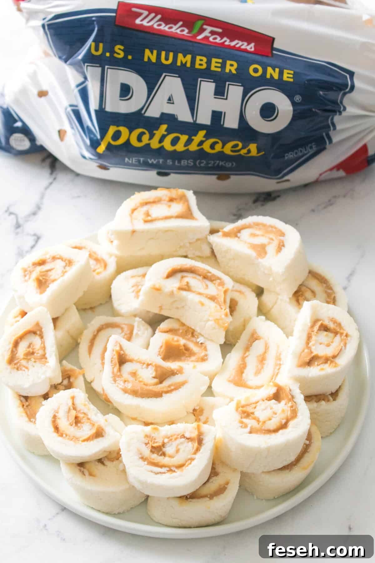 shot of potato candy on a white plate