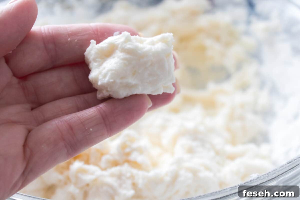 hand holding dough of potato candy
