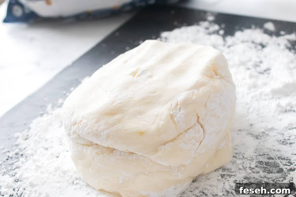 potato candy on cutting board dusted with powdered sugar