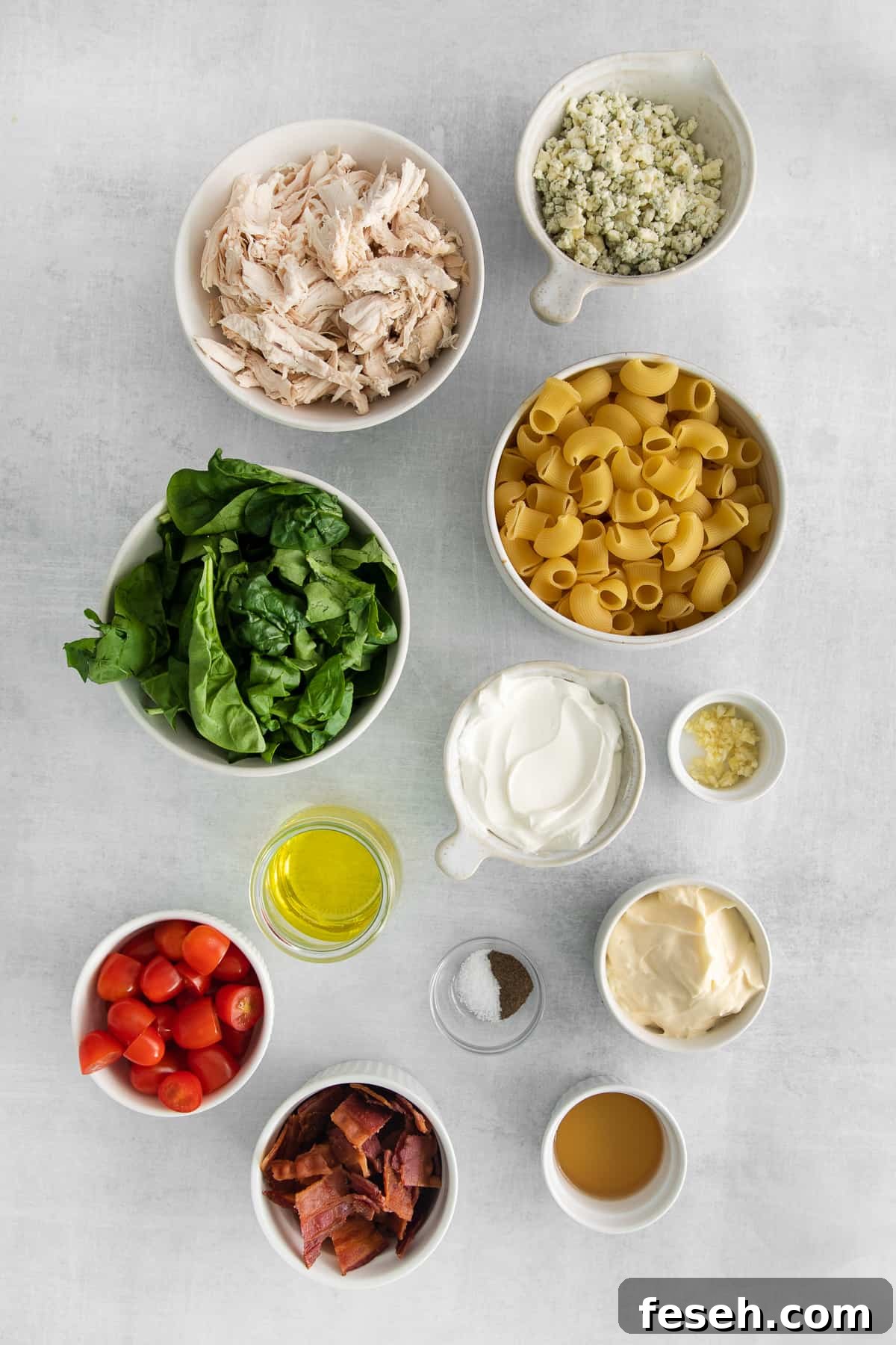Ingredients for gorgonzola chicken pasta salad in bowls.